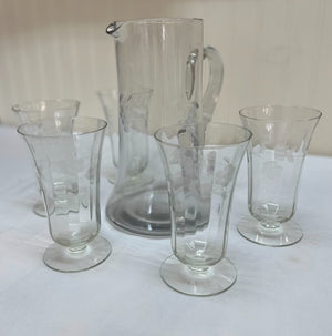 Etched clear glass pitcher with matching glasses