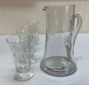 Etched clear glass pitcher with matching glasses