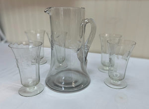 Etched clear glass pitcher with matching glasses